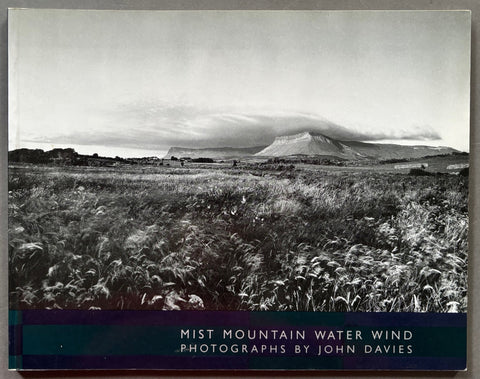 Book titled 'Mist Mountain Water Wind' by john Davies with a cover featuring the black and white image of a British landscape.