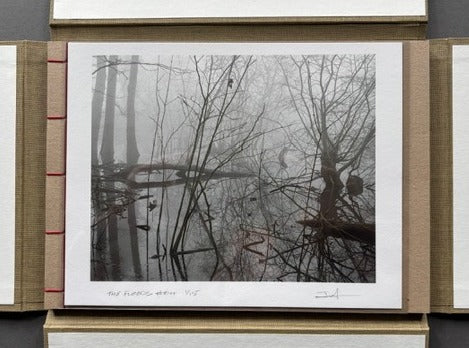 Book titled 'The Floods' from the collectors edition in a hand bound slipcase.