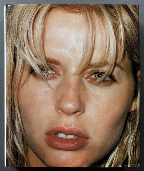 Book titled 'Juergen Teller' by Juergen Teller witha cover featuring a close up image of a blonde woman's face.
