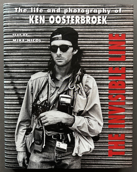 Book titled 'The Invisible Line: The Life and Photography of Ken Oosterbroek' with a cover featuring a black and white image of the artist.