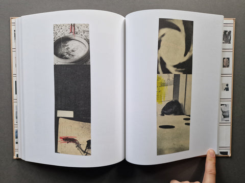 An open book, showing two open pages with vertical collage prints featuring black, white, beige, and muted yellow imagery. 