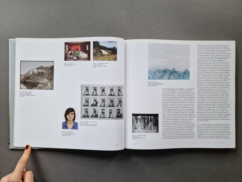 An open book spread showing multiple photos positioned throughout both pages with text on the right page