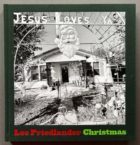 Book titled 'Christmas' by Lee Freidlander with a green cover featuring the image of a house and it's Christmas decorations.