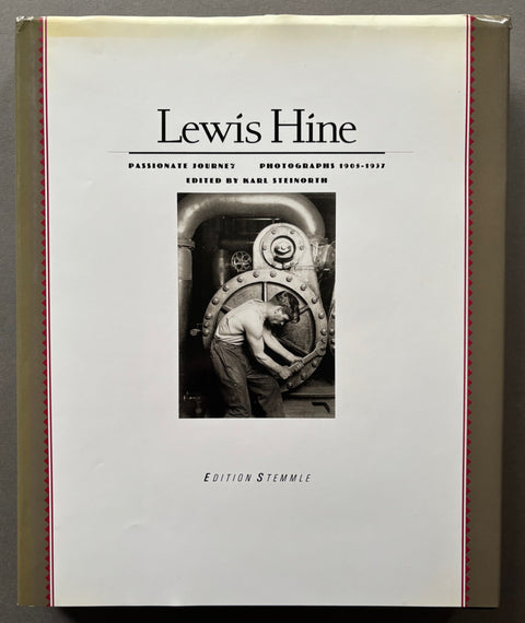 Book titled 'Passionate Journey: Photographs 1905-1937' by Lewis Hine with a white cover featuring a man working on a piece of industrial machinery.