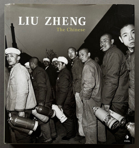 Book titled 'The Chinese' By Liu Zheng with a cover featuring a black and white image of Chinese men carrying flasks.