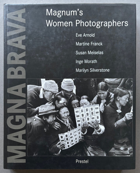 Book titled 'Magna Brava: Magnum's Women Photographers by various artists with a black cover featuring an image taken by Marilyn Silverstone.