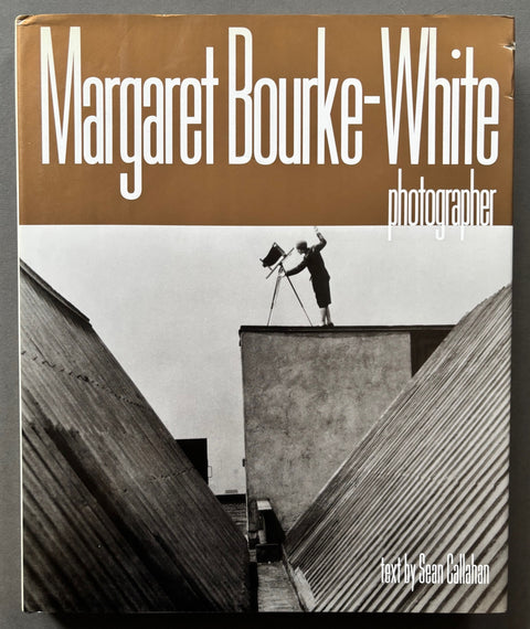 Book titled 'Margaret Bourke-White: Photographer' by Margaret Bourke-White with a cover featuring the image of a woman standing on a roof with a camera.