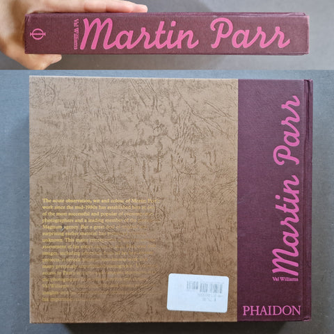 A hardcover book titled "Martin Parr" by Val Williams published by  Phaidon, shown from both the back cover and the spine