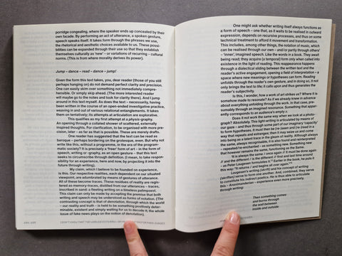 An open book showing two printed pages with black text on white paper.