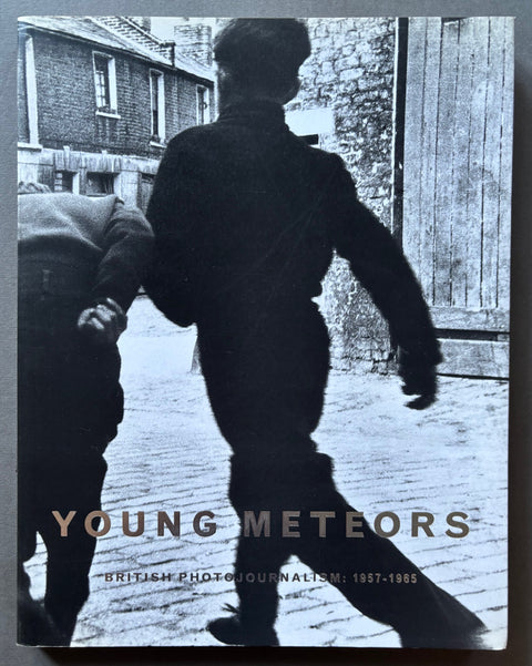Book titled 'Young Meteors: British Photojournalism 1957-1965' by Martin Harrison with a black and white cover featuring the images of young boys playing in the street.