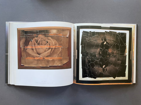An open art book or magazine laid flat on a dark gray surface, showing two illustrated pages with layered collage-style imagery: a rose on the left and a dark figure on the right, both overlaid with cracked glass textures.