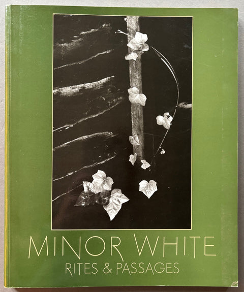 Book titled 'Rites & Passages' by Minor White with a green cover featuring a black and white image of an ivy plant.