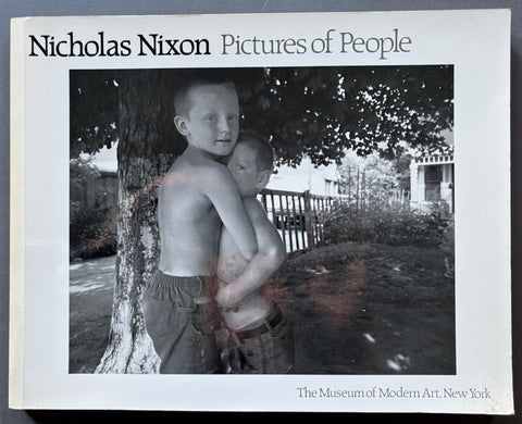Book titled 'Pictures of People' by Nicholas Nixon with a white cover featuring a black and white image of 2 young boys in an embrace.