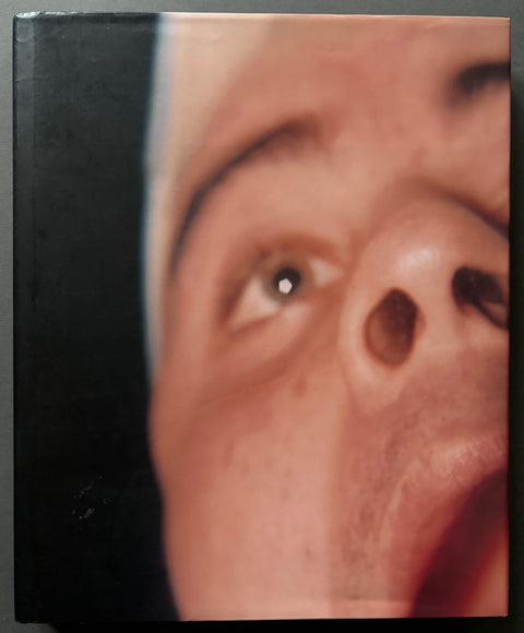 Book titled 'Safety in Numbers' by Nick Waplington with a cover featuring the close up image of a man's face.