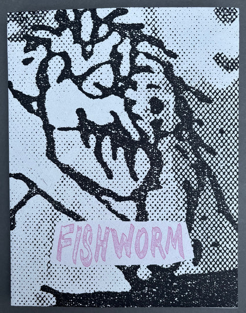 Book titled 'Fishworm' by Pia Paulina Guilmoth and Jesse B. Saffire with a black and grey cover.