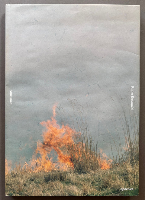 Book titled 'Ametsuchi' By Rinko Kawauchi with a dust jacket featuring a photograph of burning grassland.