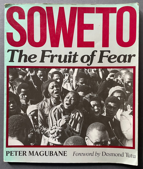 Front cover of SOWETO, The Fruit of Fear by Peter Magubane with a black and white photo of people mourning. 