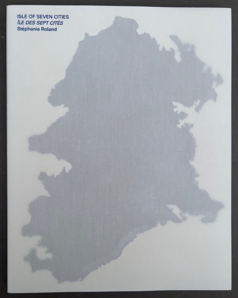 Book titled 'Isle of Seven Cities' by Stephanie Roland with a white cover featuring the image of an island.