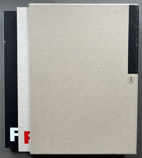 Books titled 'Forstate + Retrograd' by Stig Stasig with black and grey covers in a grey card slipcase.