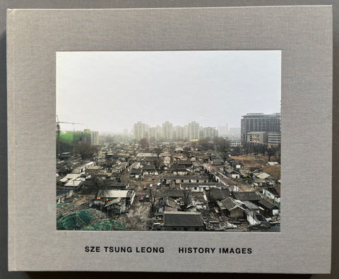 Book titled 'History Images' by Sze Tsung Leong with a grey cover featuring a tipped in landscape image of a city in China.