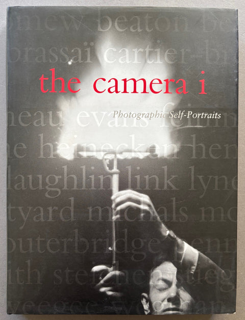Book titled 'The Camera I: Photographic Self-Portraits' by various artists with a black cover featuring the image of a photographer igniting a flash.