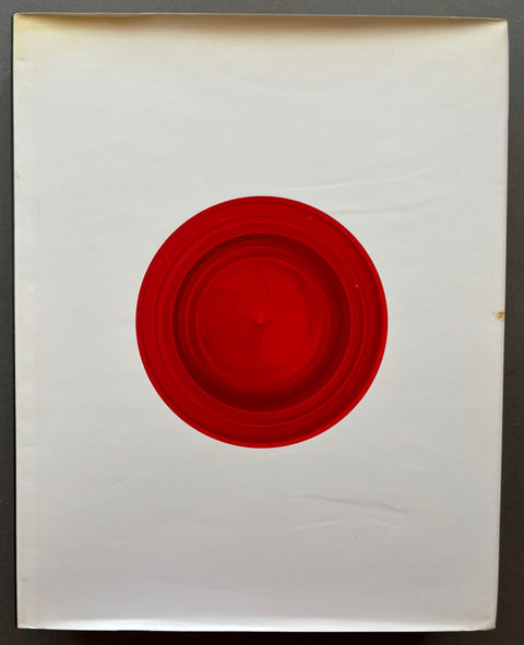 Book titled 'The History of Japanese Photography' by Anne Wilkes Tucker with a white cover with a red circle.