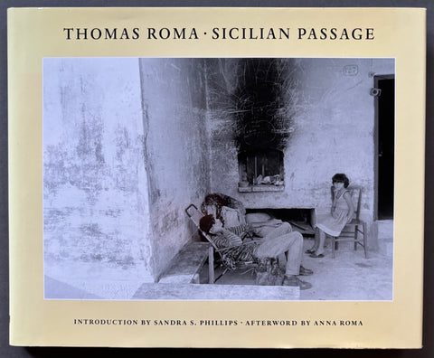 Book titled 'Sicilian Passage' by Thomas Roma with a beige cover featuring a black and white image of a people sitting outside a house/