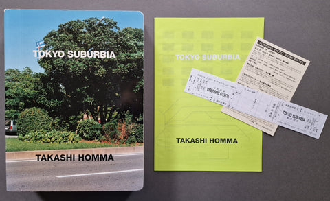 The Tokyo Suburbia book by Takashi Homma displayed alongside its bright lime-green booklet.