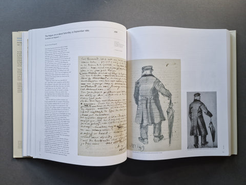 An open book laid flat on a dark surface, showing two printed pages with handwritten script on the left and black-and-white historical illustrations on the right.