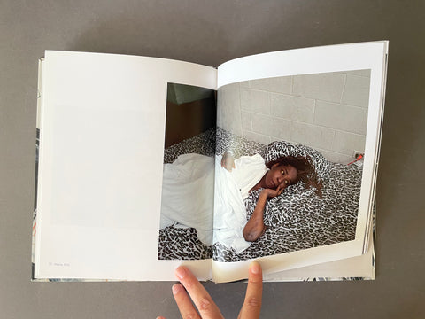 Portrait of a woman lying on bed. 