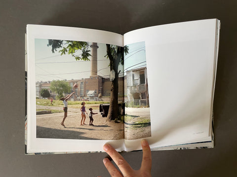 Children playing basketball on street in Chicago. 