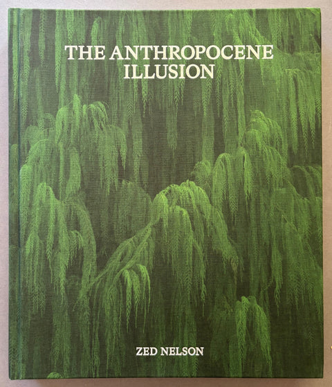 Book titled The Anthropocene Illusion by Zed Nelson with a green cover featuring the image of a tree.