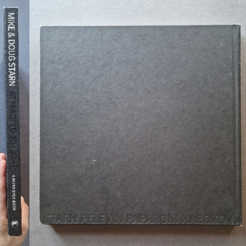 The spine and back cover of Attracted To Light by Doug and Mike Starn