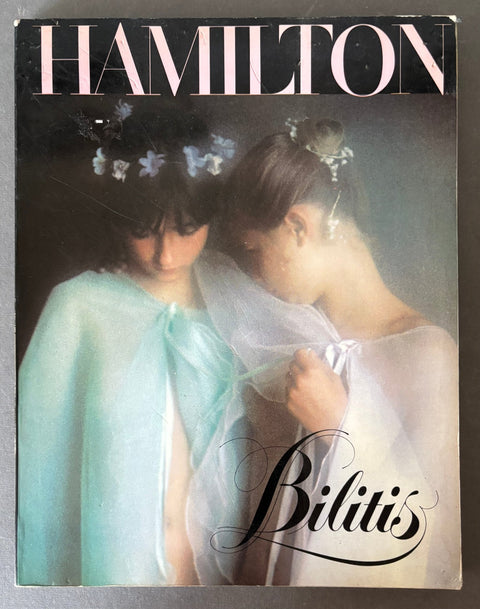 Vintage fashion magazine cover titled HAMILTON with the subtitle Bilitis, featuring two women in flowing sheer white and pale blue garments against a dark background.