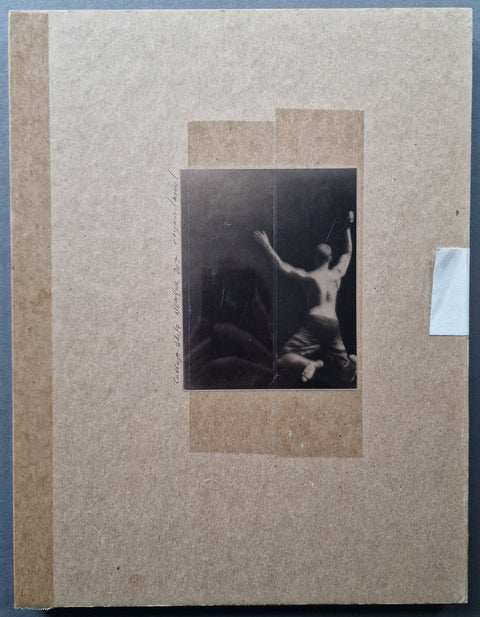 The box lid of cabbage white by Raymond Meeks with a silver gelatin print of a jumping in water person mounted with tape