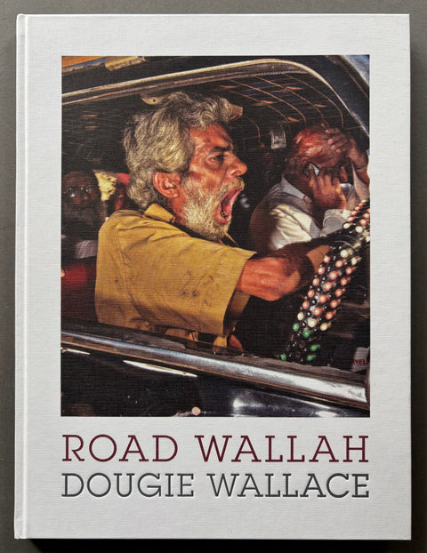 Book titled 'Road Wallah' by Dougie Wallace with a white cover featuring an image of a driver who appears to be shouting.