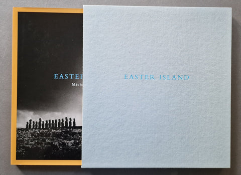 A book titled 'EASTER ISLAND' by Michael Kenna, light blue slipcase and orange hardback