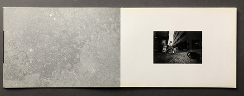 Framed black and white photograph on a textured gray background