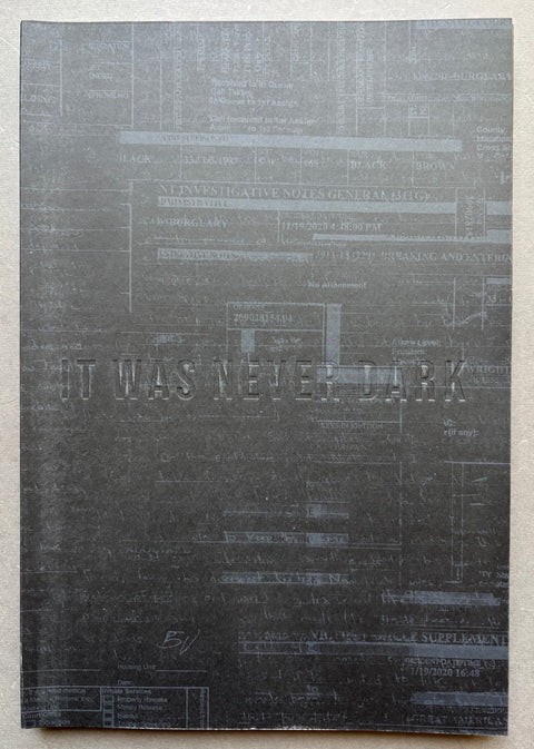 Book titled 'It Was Never Dark' by Isaac Wright with a grey cover.