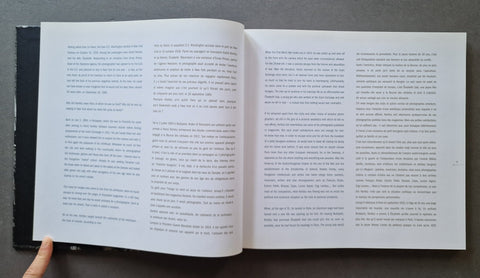An open book Made in USA by Andre Kertesz showing two printed text pages with text both in English and French