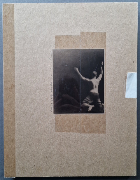 The box lid of cabbage white by Raymond Meeks with a silver gelatin print of a jumping in water person mounted with tape