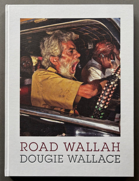 Book titled 'Road Wallah' by Dougie Wallace with a white cover featuring an image of a driver who appears to be shouting.