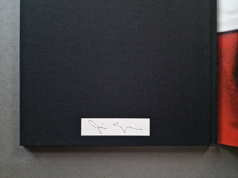 The signature panel signed by jim Goldberg and tipped to back board.