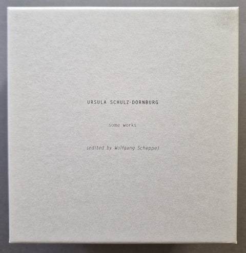 The front  panel of the limited edition box set with the following text  'URSULA SCHULZ-DORNBURG', 'somo works', and '(edited by Wolfgang Scheppe)' in a small, centered, black typewriter font against a textured off-white background.