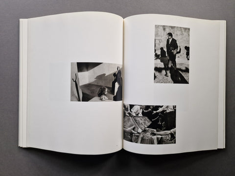 An open book spread showing three photographs in black and white.
