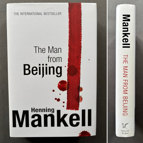 The image shows the cover and the side view of a book titled 'The Man from Beijing' by Henning Mankell. The cover has a white background with the title and author's name, and a red stripe on the left side.