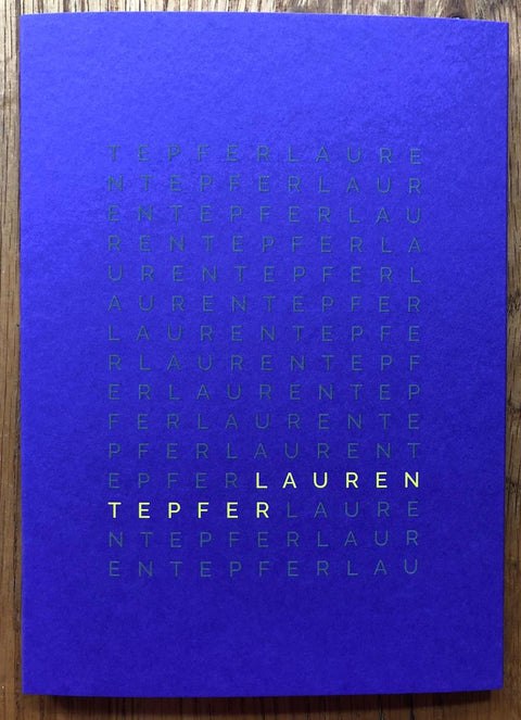 The cover of 006 by Lauren Tepfer. Softcover book with card wraparound cover in bright blue/purple.