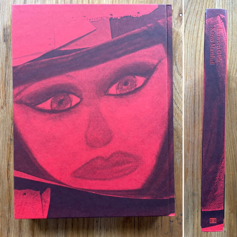 The photography book cover of Between Girls by Karen Marshall.  In hardcover red.