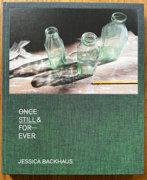 The photobook cover of Once Still & Forever signed by Jessica Backhaus . In hardcover green. Signed.
