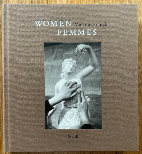 The photobook cover of Women - Femmes by Martine Franck. In hardcover brown.